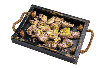 Arabic Halva with pistachio isolated on a white background. Natural vegan sweets