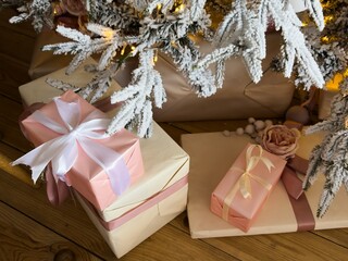 presents under a christmas tree and cozy lighting