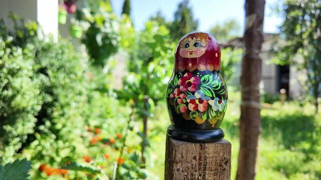 wooden matryoshka doll. Hand Holding a Wooden Matryoshka Doll &ndash; Traditional Russian Nesting Doll. Collection of traditional Russian nesting dolls. Beautiful handmade matryoshka dolls in a row.