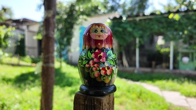 wooden matryoshka doll. Hand Holding a Wooden Matryoshka Doll &ndash; Traditional Russian Nesting Doll. Collection of traditional Russian nesting dolls. Beautiful handmade matryoshka dolls in a row.
