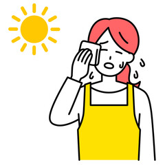 熱中症になるエプロン姿の女性