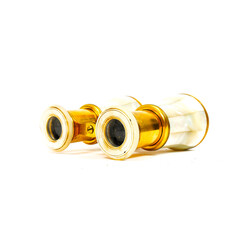 Ancient ( 19th century) theatre binocular covered in brass and mother of pearl