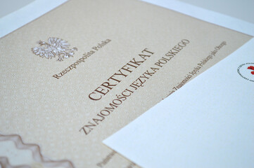Polish language proficiency certificate B1 level with national emblem on white background