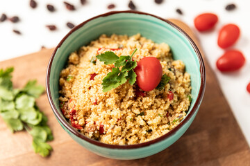 Moroccan couscous salad with fresh cherry tomatoes and raisins