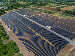 Aerial view of solar panel and power station with energy storage.