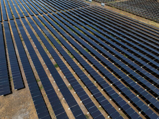 Aerial view of solar panel and power station with energy storage.