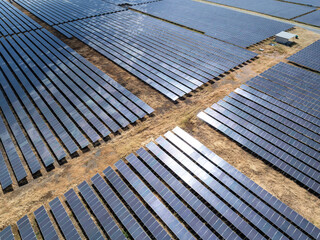 Aerial view of solar panel and power station with energy storage.
