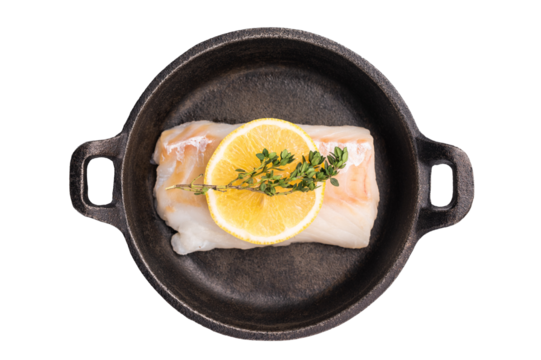 Raw cod fish fillets, whitefish without skin in skillet isolated on white background