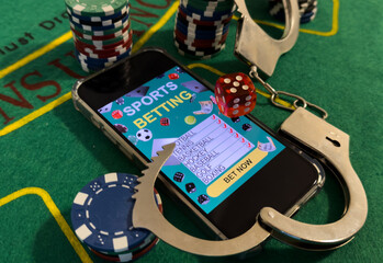 Cards cubes and chips Handcuffs close-up. Royal flush poker. Prohibited gambling concept, internet...