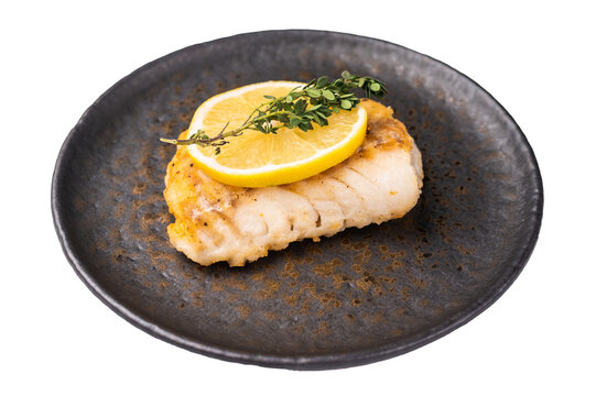 Roast Halibut fish loin fiilet on plate isolated on white background