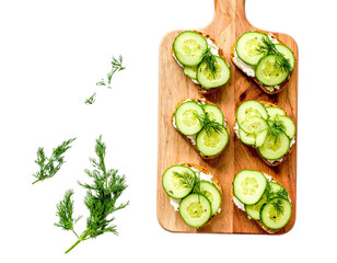 Cucumber Sandwiches with Dill on Wooden Board – Top View

