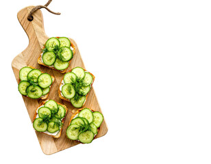 Cucumber Sandwiches with Dill on Wooden Board – Top View

