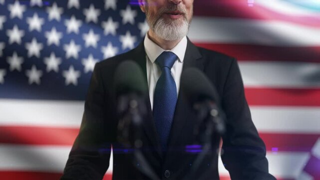 Happy male congressman speaking at press conference on U.S. flag background