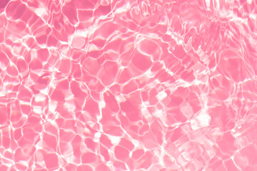 Pink water bubbles on the surface ripples. Defocus blurred transparent pink colored clear calm...