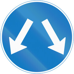 Regulatory road sign in Uganda - Pass Either Side