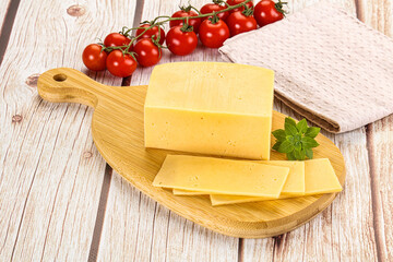 Yellow cheese piece with slices