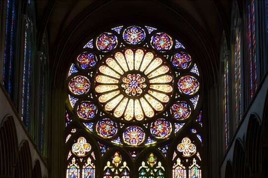 Cathedral's Ornate Rose Window: A kaleidoscope of stained glass and architectural artistry. - Powered by Adobe