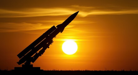 Silhouette of a ballistic rocket soaring against a vibrant sunset sky. A powerful and symbolic scene perfect for topics of war, defense, and global tension