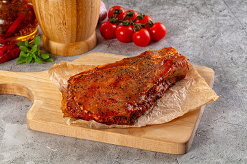 Raw marinated pork loin steak
