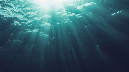 Underwater Light Beams with Refraction in Blue - Green Gradient Ocean Background