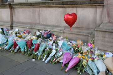 Red Heart Balloon and Flowers Left as a Mark of Respect and Remembrance 