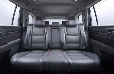 Experience the refined comfort of a contemporary vehicle's rear passenger cabin with luxurious dark leather seating.
