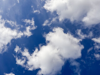 Fluffy Cumulus Clouds Scattered across Vibrant Blue Sky