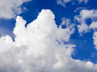 Fluffy Cumulus Clouds Scattered across Vibrant Blue Sky