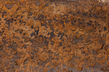 Rusted metal surface showing texture and discoloration outdoors