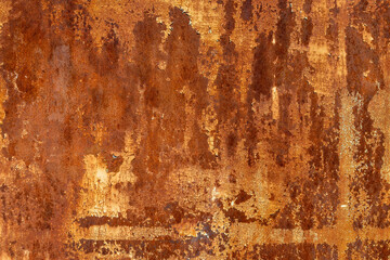 Rusty metal surface with corrosion and paint flaking outdoors