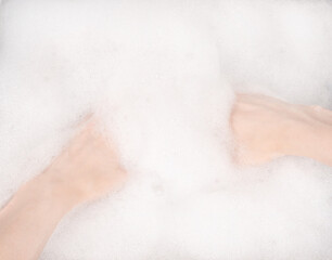Female hands in foam close-up. girl's hands in soap foam. washing, cleaning, washing dishes