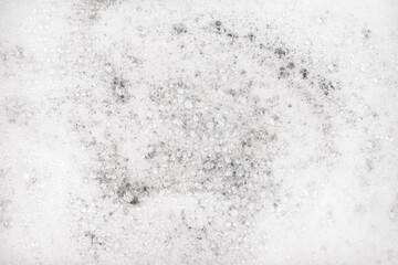 White pure foam in water background texture. dishwashing foam close up