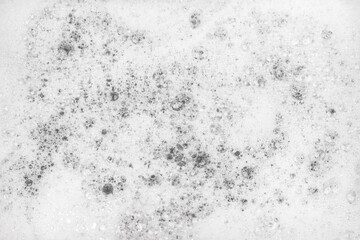 White pure foam in water background texture. dishwashing foam close up