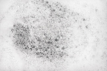 White pure foam in water background texture. dishwashing foam close up
