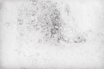 White pure foam in water background texture. dishwashing foam close up