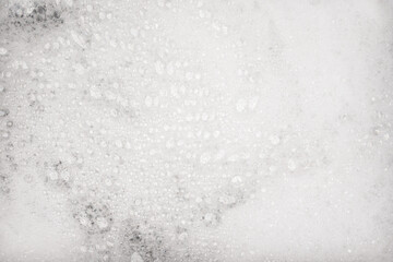 White pure foam in water background texture. dishwashing foam close up