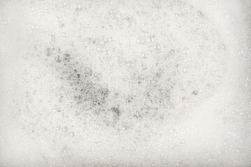Fototapeta premium White pure foam in water background texture. dishwashing foam close up