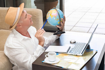 Freelance educator explores geography while working online from a cozy indoor space