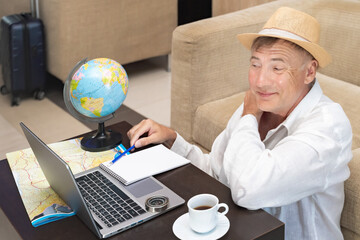 Freelancer working on geography projects while enjoying coffee in a cozy setting