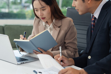 Asian business people working as a good team in the office. Successful teamwork in a meeting, workplace concept.