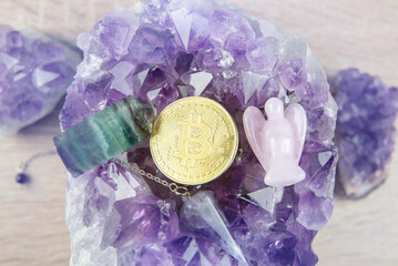 A gold Bitcoin coin resting inside an open amethyst quartz geode. Spiritual cryptocurrency and investment concept.