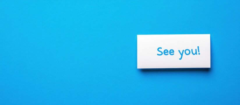 White 'See you!' card on blue background