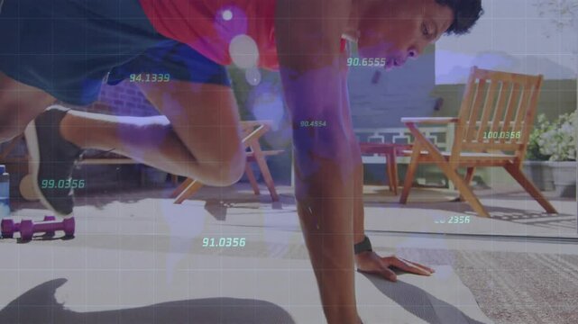 Man placing hands shoulder-width on mat and performing alternating knee drives for core strength