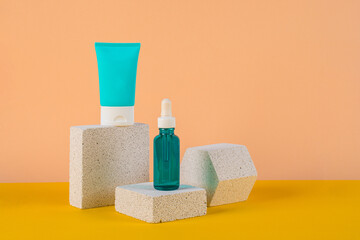 Plastic white tube for cream or lotion. Skin care or sunscreen cosmetic with stylish props on cream...