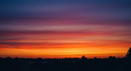 Fototapeta premium Sunset Over Silhouette Landscape Capturing the Beauty of Nature's Vibrant Colors in the Sky
