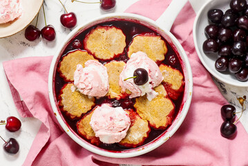 Cherry Cobbler with Honey Butter Vanilla Bean Biscuits in  pan