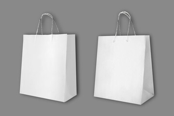 Recycled empty blank white paper shopping bag mockup isolated over grey background. 3d rendering.
