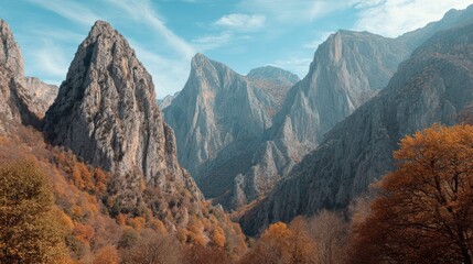 Mountain peaks with autumn foliage under a blue sky landscape.