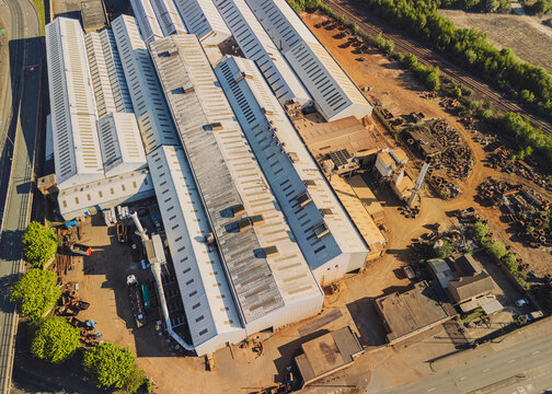 Gateshead UK: 10th May 2025: Drone view of warehouse complex in Gateshead featuring industrial activities under clear skies in Gateshead City