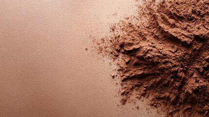 This image features a soft beige background complemented by scattered brown powder, creating a visual contrast that reflects warmth and the natural beauty of earthy tones.